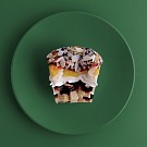 картинка Десерт кап с творожным кремом, ананасом, бананом и миндалем TakeEat